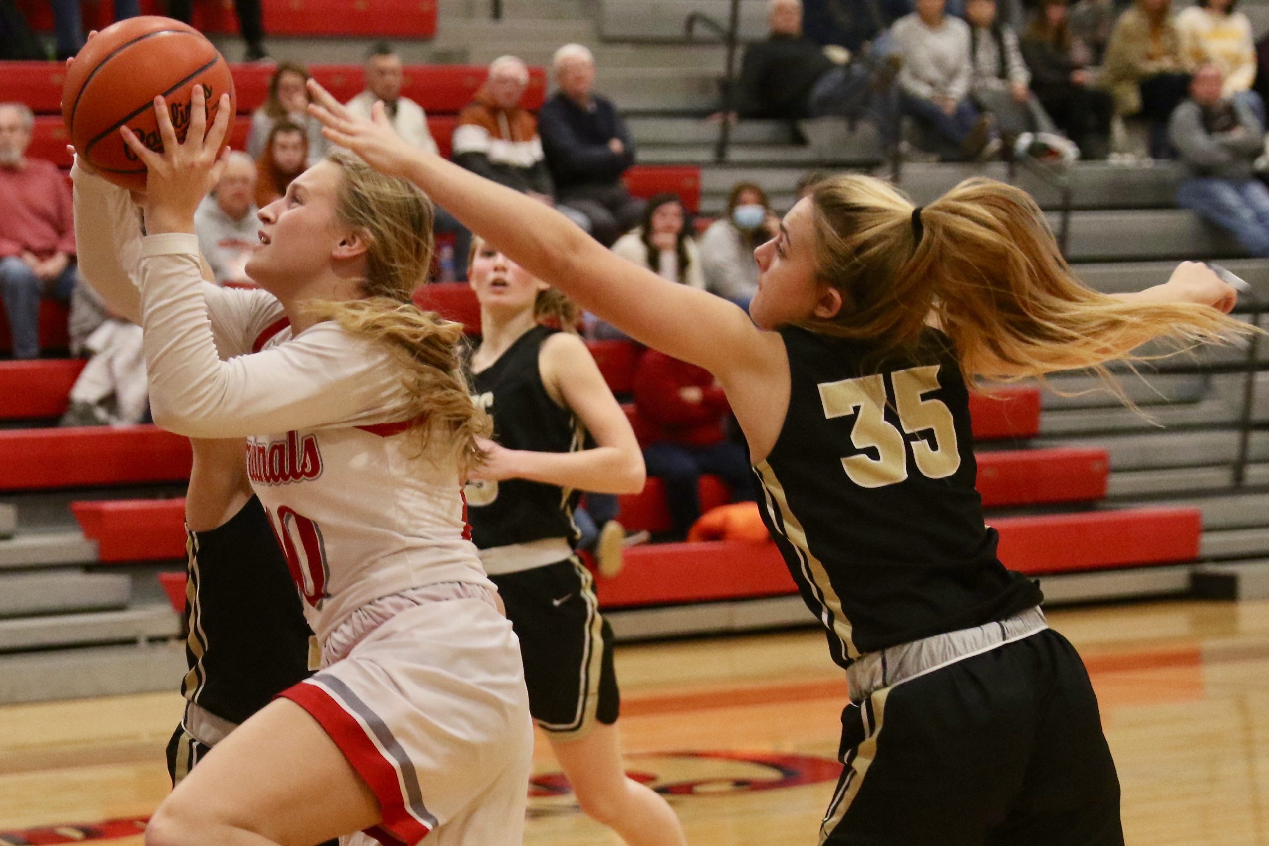 Sandy Valley’s Jordan Parker drives to the basket as Tuscarawas Central Catholic’s Delaney Savage defends in the game Wednesday (JMN Sports/Jim Cummings).