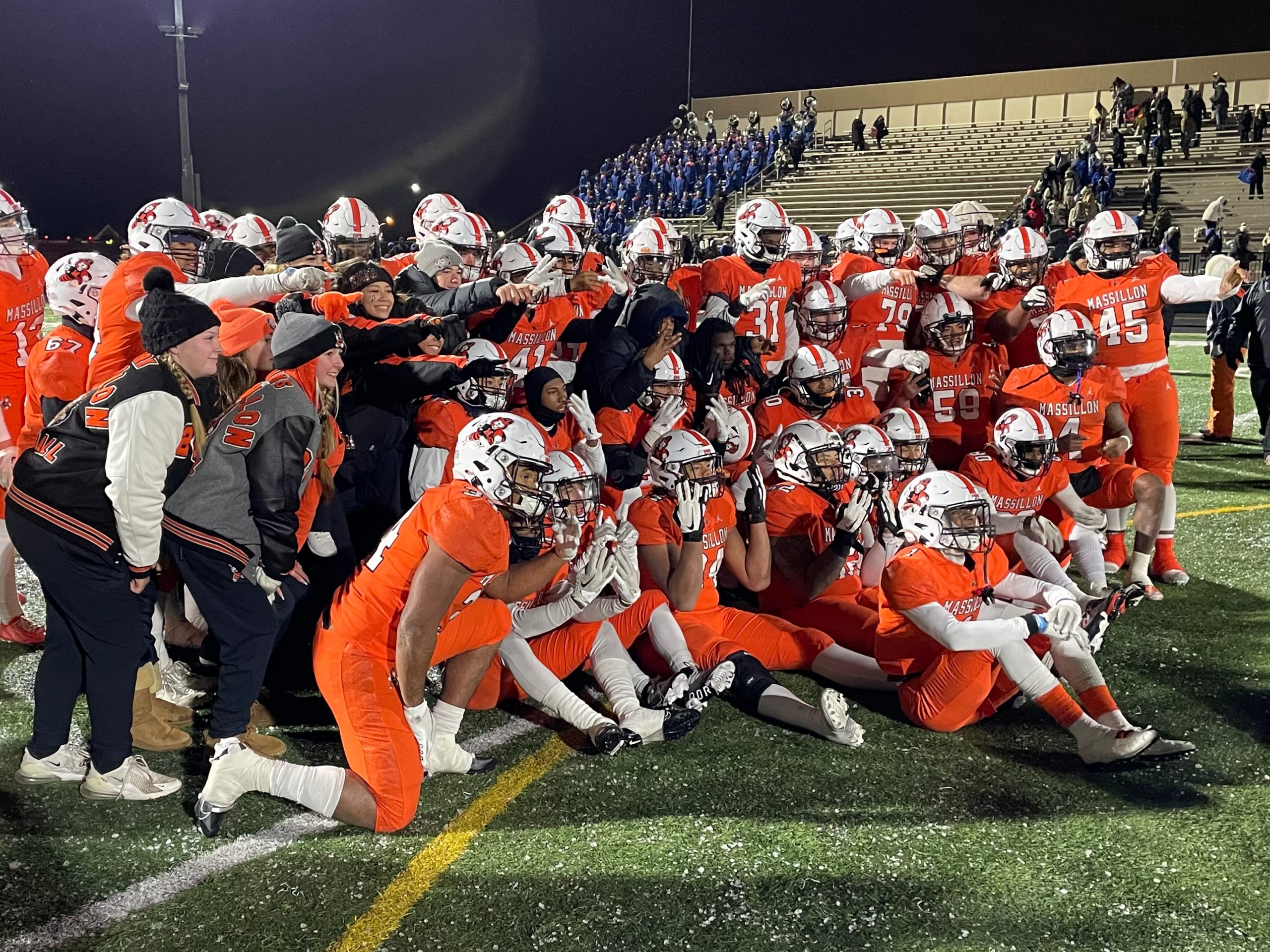 The Massillon Tigers celebrate their Division II, Region 7 final win over Lake, 24-6, at Byers Field in Parma (Photo credit: Mitch Spinell).
