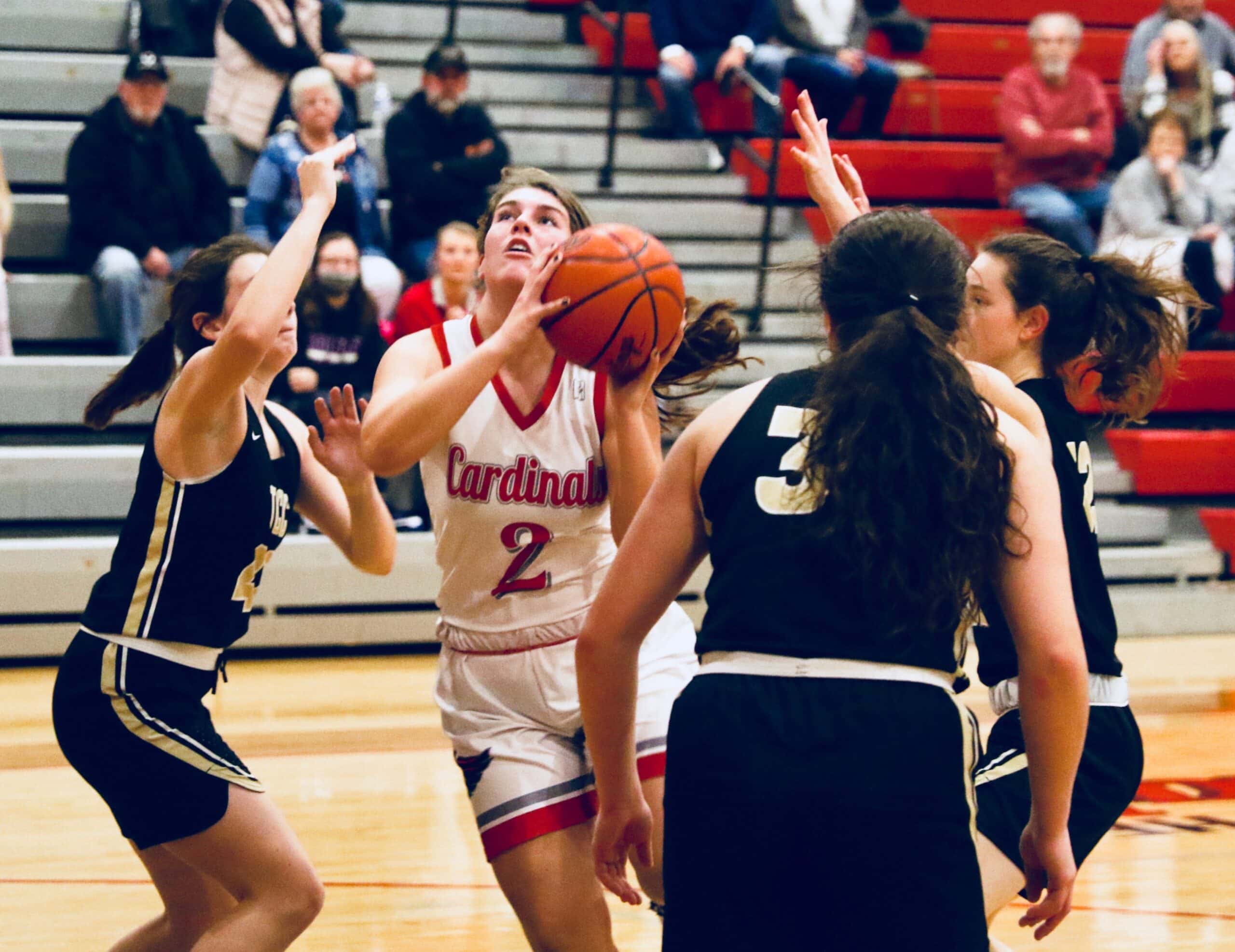 Sandy Valley’s Alli Neary drives to the basket between a host of Central defenders